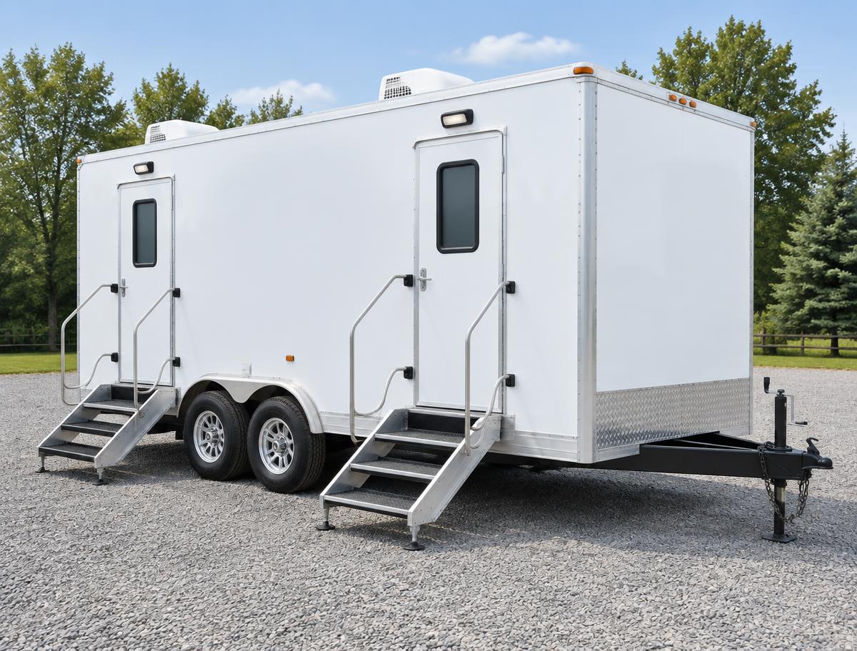 White portable restroom trailer with two separate entrances