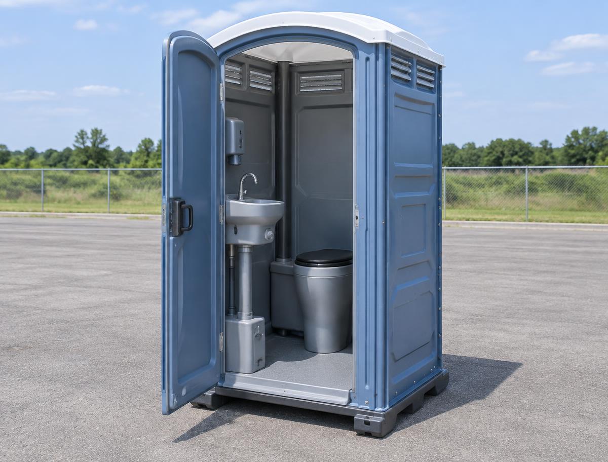 Portable toilet with interior handwashing sink visible through open door
